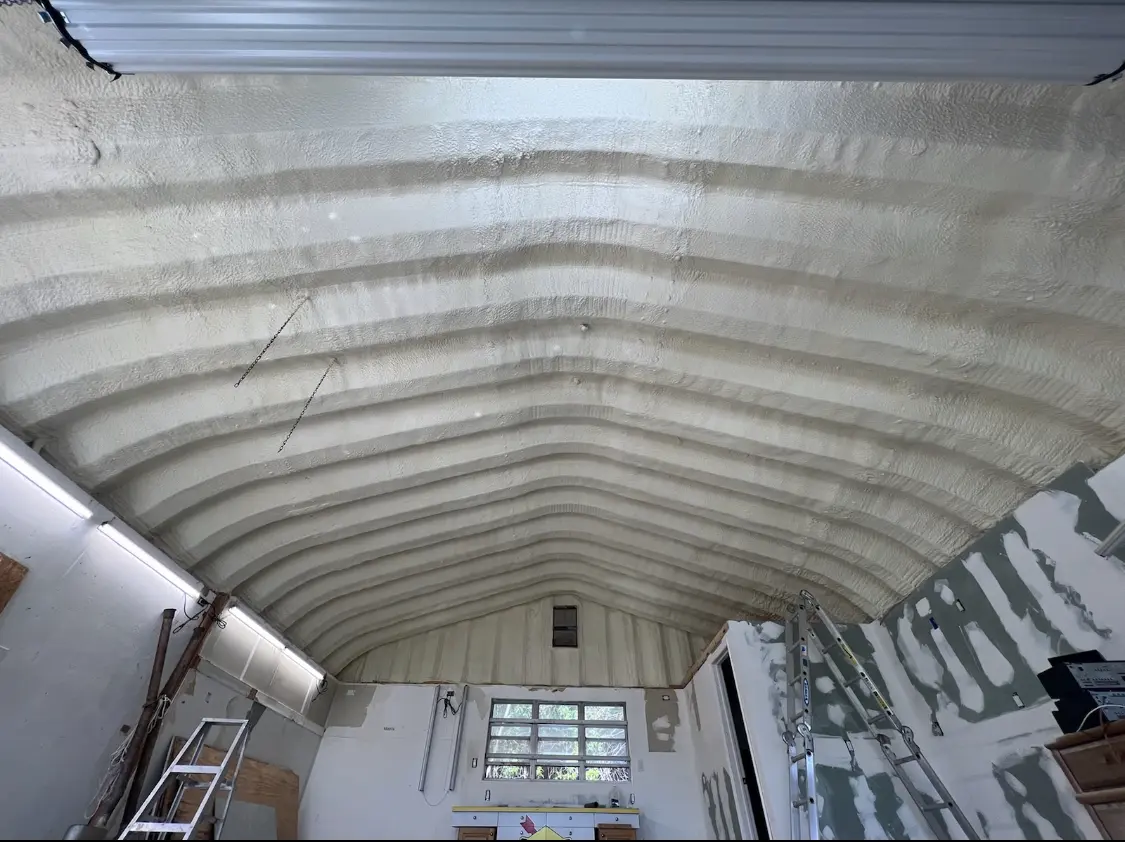 Spray polyurethane foam applied to the underside of a metal roof deck in Huntington Woods